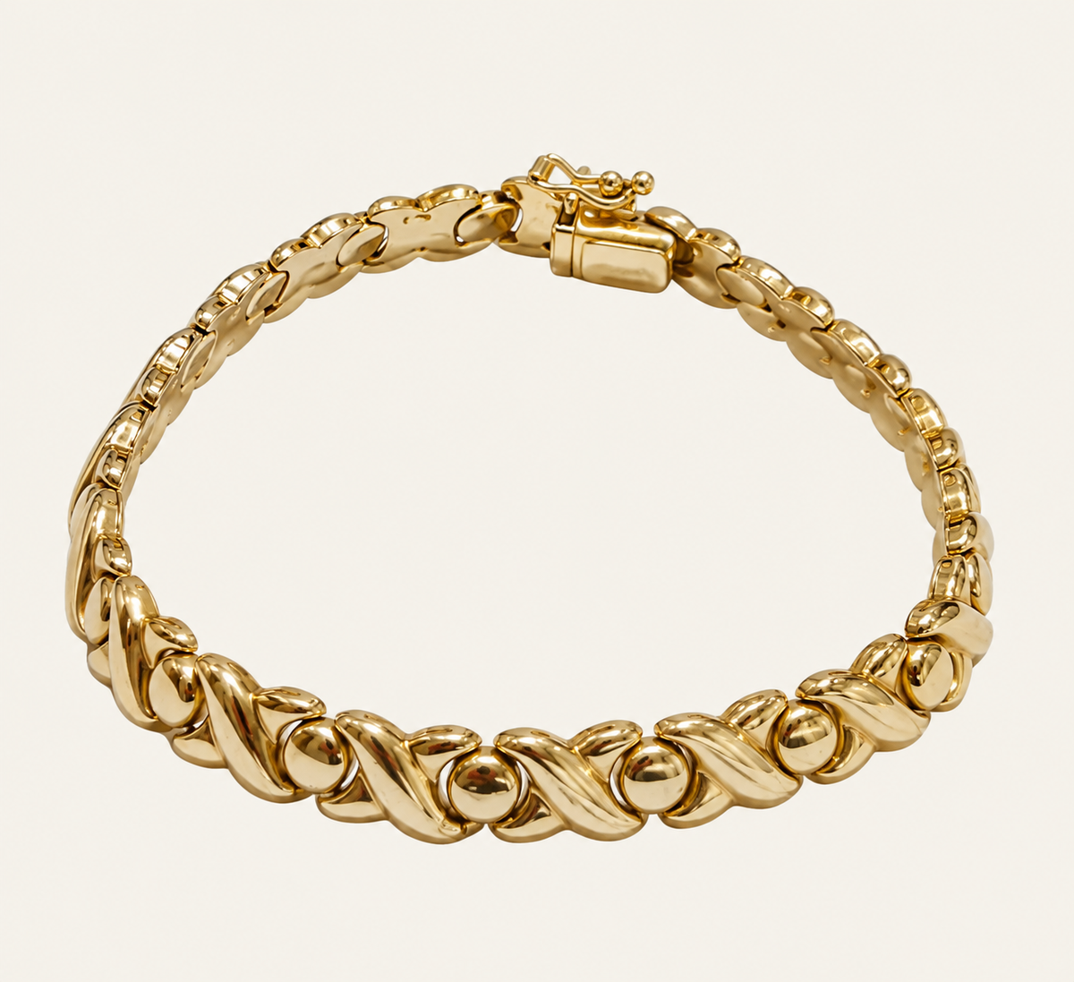 14KT Yellow Gold X&O Bracelet 6.3mm 7" – R193